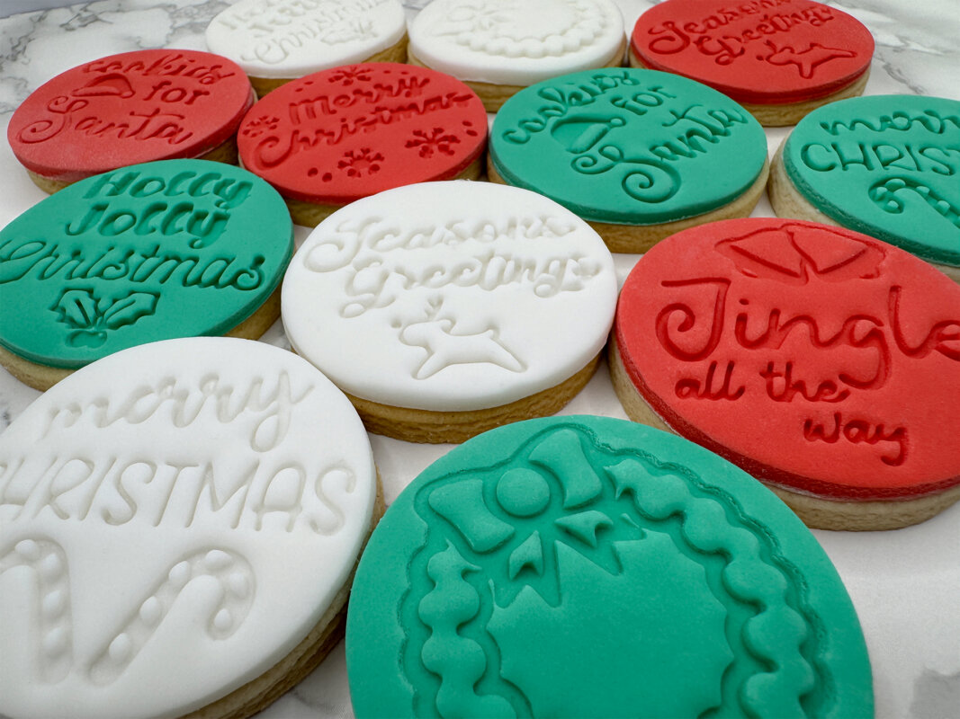 Red, white and green Christmas biscuits decorated with LilyAnne fondant stamp designs